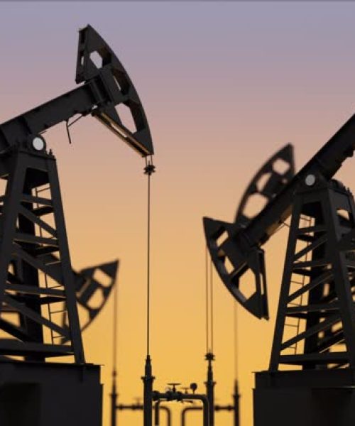 Black oil rigs on sunset. Loopable animation.